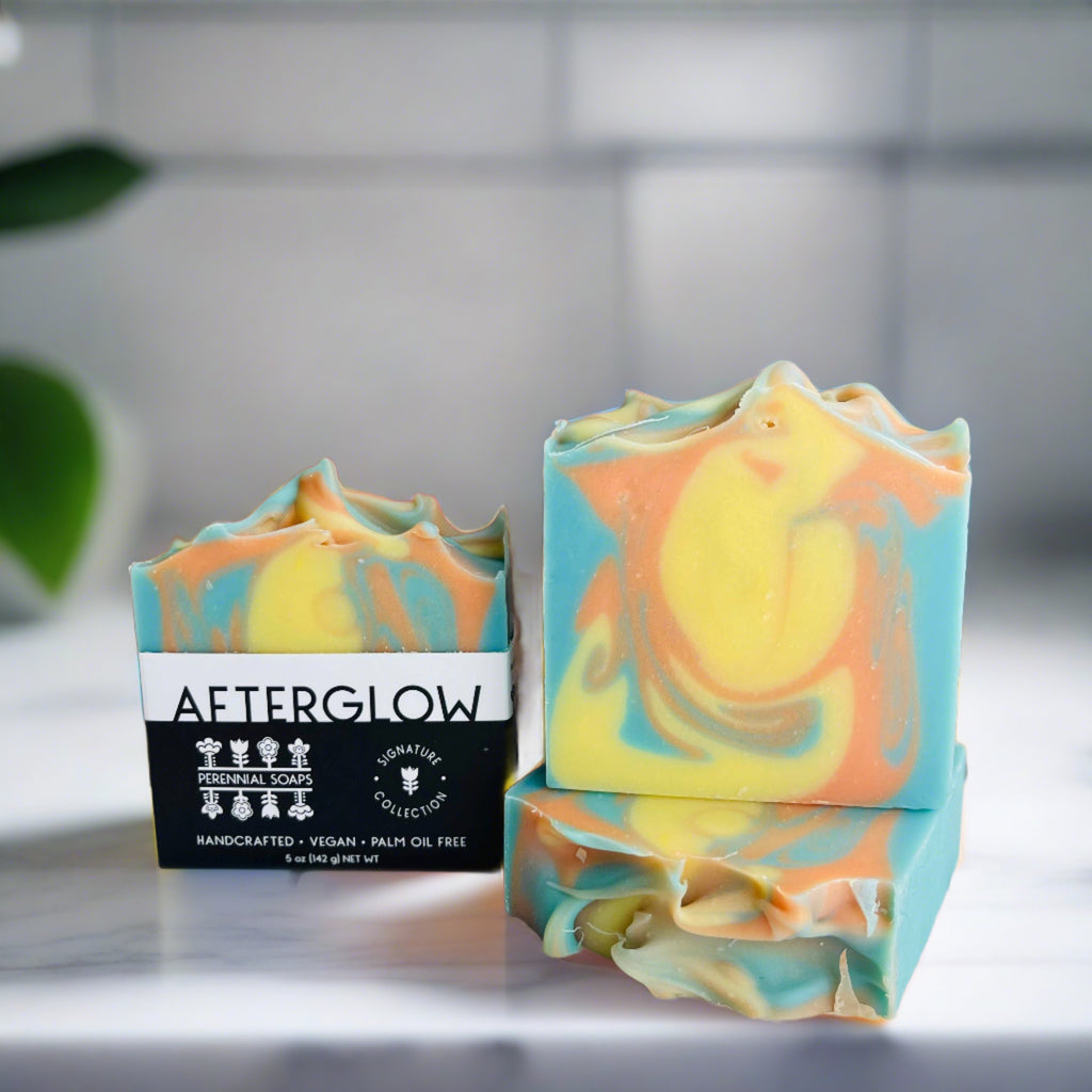Orange, blue and yellow swirls in soap, stacked together
